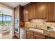 Kitchen view showing custom cabinets, stainless appliances, granite, and open flow to the living room at 2233 Peachtree Ne Rd # 903, Atlanta, GA 30309