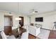 Sun-filled living room featuring hardwood floors, dining area, and updated lighting with views of the city at 2233 Peachtree Ne Rd # 903, Atlanta, GA 30309