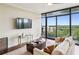 Open-concept living room featuring floor-to-ceiling windows and a neutral color palette at 2233 Peachtree Ne Rd # 903, Atlanta, GA 30309