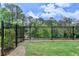 A lush fenced backyard with green grass and privacy landscaping at 240 Walker Avenue, Roswell, GA 30076