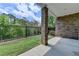 Patio area leading to a fenced backyard with green grass at 240 Walker Avenue, Roswell, GA 30076