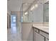 Bathroom featuring sleek vanity with modern fixtures, quartz countertop, and glass shower stall at 240 Walker Avenue, Roswell, GA 30076