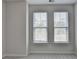 Bright bedroom with two large windows and neutral carpet at 240 Walker Avenue, Roswell, GA 30076
