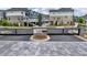 View of the gated entrance to a modern townhome community with brick and stone accents at 240 Walker Avenue, Roswell, GA 30076
