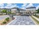 Gated entrance to a modern community of townhomes featuring beautiful pavers and landscaping at 240 Walker Avenue, Roswell, GA 30076