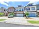 Attractive townhomes show individual design and attached garages with manicured landscaping at 240 Walker Avenue, Roswell, GA 30076