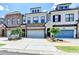Attractive townhomes show individual design and attached garages with manicured landscaping at 240 Walker Avenue, Roswell, GA 30076