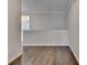 Upstairs hallway featuring hardwood floors and neutral colored paint at 240 Walker Avenue, Roswell, GA 30076