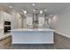 Modern kitchen featuring sleek white cabinets, a stainless steel range hood, and hardwood floors for a contemporary feel at 240 Walker Avenue, Roswell, GA 30076