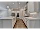 Modern kitchen featuring white cabinets, large island, and stainless-steel appliances at 240 Walker Avenue, Roswell, GA 30076