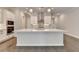 Modern kitchen with a large center island, white cabinets, and stainless steel appliances at 240 Walker Avenue, Roswell, GA 30076