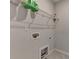 Laundry room with a wire shelf above the hookups, and tiled floors at 240 Walker Avenue, Roswell, GA 30076