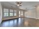 Inviting living room with hardwood floors, ample natural light, and modern ceiling fan, for comfort and style at 240 Walker Avenue, Roswell, GA 30076