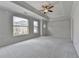 Large main bedroom featuring tray ceilings, carpet flooring, and abundant natural light at 240 Walker Avenue, Roswell, GA 30076