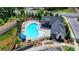 Aerial view of a kidney-shaped community pool with lounge chairs and umbrellas, adjacent to the pool house at 240 Walker Avenue, Roswell, GA 30076