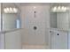 Modern tiled shower with glass enclosure and rain shower head at 240 Walker Avenue, Roswell, GA 30076