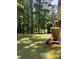 A spacious, well-maintained backyard with lush green grass and mature trees at 9278 Seminole Rd, Jonesboro, GA 30236