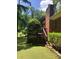 Backyard view featuring a wooden deck with steps leading down to the lawn at 9278 Seminole Rd, Jonesboro, GA 30236