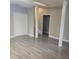 Finished basement space with modern flooring, neutral paint, and white support pillars at 9278 Seminole Rd, Jonesboro, GA 30236
