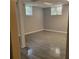 Basement featuring finished flooring, two windows, and neutral paint at 9278 Seminole Rd, Jonesboro, GA 30236