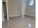 Basement featuring modern flooring, neutral paint, and natural light at 9278 Seminole Rd, Jonesboro, GA 30236