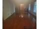 Bright bedroom features gleaming hardwood floors and natural light from a large window at 9278 Seminole Rd, Jonesboro, GA 30236