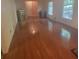 Bright bedroom features gleaming hardwood floors and natural light from a large window at 9278 Seminole Rd, Jonesboro, GA 30236