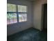 Cozy bedroom features a window with natural light, and a built-in closet space at 9278 Seminole Rd, Jonesboro, GA 30236