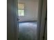 Bedroom featuring natural light from a window and vintage carpet at 9278 Seminole Rd, Jonesboro, GA 30236