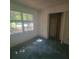 Bedroom featuring carpet and natural light from large windows at 9278 Seminole Rd, Jonesboro, GA 30236