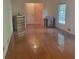 Bright bedroom features gleaming hardwood floors and natural light from a large window at 9278 Seminole Rd, Jonesboro, GA 30236