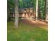 Charming two-story home with brick accents nestled amongst mature trees on a large lot at 9278 Seminole Rd, Jonesboro, GA 30236