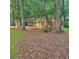 Charming two-story home with brick accents nestled amongst mature trees on a large lot at 9278 Seminole Rd, Jonesboro, GA 30236