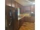 Kitchen with stainless steel appliances and oak cabinets, granite countertops at 9278 Seminole Rd, Jonesboro, GA 30236