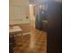 View of kitchen, and attached dining area, with stainless steel refrigerator and tile floor at 9278 Seminole Rd, Jonesboro, GA 30236