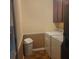 Functional laundry room features a washing machine, dryer, cabinets, and tiled flooring at 9278 Seminole Rd, Jonesboro, GA 30236