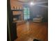 Comfortable living room featuring hardwood floors and a brick fireplace, perfect for relaxing at 9278 Seminole Rd, Jonesboro, GA 30236