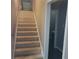Carpeted staircase leading to the upper or lower level of the home at 9278 Seminole Rd, Jonesboro, GA 30236