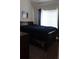 Bedroom with a large window and a dark blue bed at 1425 Watercrest Cir, Lawrenceville, GA 30043