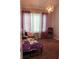 Bedroom with purple and white curtains, plush carpet, and a unique chandelier at 1425 Watercrest Cir, Lawrenceville, GA 30043