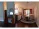 Dining area showcasing a wooden table with tufted chairs and stylish lighting at 1425 Watercrest Cir, Lawrenceville, GA 30043