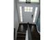 Bright foyer with glass-paneled front door and dark hardwood floors on the staircase entry at 1425 Watercrest Cir, Lawrenceville, GA 30043