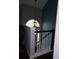 Hallway featuring a white staircase and modern pendant lighting at 1425 Watercrest Cir, Lawrenceville, GA 30043