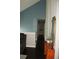 Upstairs hallway featuring blue accent wall and dark wood flooring at 1425 Watercrest Cir, Lawrenceville, GA 30043