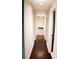 The home's hallway features dark wood floors and neutral-painted walls at 1425 Watercrest Cir, Lawrenceville, GA 30043