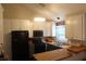 Modern kitchen with white cabinets, black appliances, and ample countertop space at 1425 Watercrest Cir, Lawrenceville, GA 30043