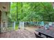 Spacious outdoor back deck with multiple seating areas, perfect for entertaining or relaxing at 220 N Springs Ct, Sandy Springs, GA 30328