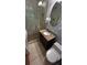 Well-lit bathroom with a glass-enclosed shower and a granite vanity at 220 N Springs Ct, Sandy Springs, GA 30328