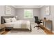 Bright bedroom with desk, window, stylish decor, and comfortable furnishings at 220 N Springs Ct, Sandy Springs, GA 30328