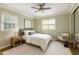 Serene bedroom featuring neutral tones, a cozy chair, and large windows at 220 N Springs Ct, Sandy Springs, GA 30328